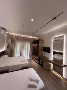 Cama o camas de una habitación en Takas Boutique