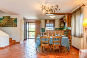 a dining room with a table and chairs at Olympus Serenity Villa in Litochoro