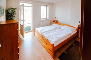 Postel nebo postele na pokoji v ubytování Hotel Palác Elektra