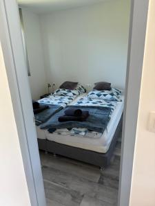 a bedroom with two beds with towels on them at Rena Vendégház in Nagykanizsa