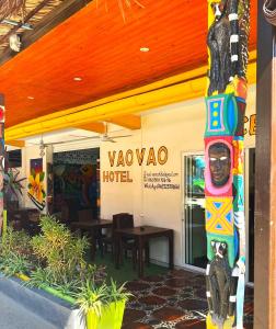 a totem pole in front of a hotel at VaoVao Hotel in Nosy Be