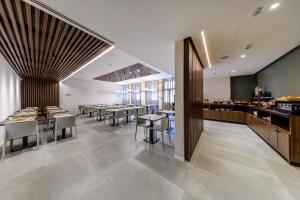 a restaurant with tables and chairs and a bar at Casa San Giuseppe in Rome