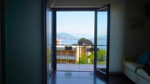 an open door to a balcony with a view at Ciceri Properties Bertarello in Baveno