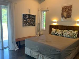 Postel nebo postele na pokoji v ubytování Manatu Holiday Home