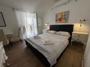 Posteľ alebo postele v izbe v ubytovaní Apartment Ariana