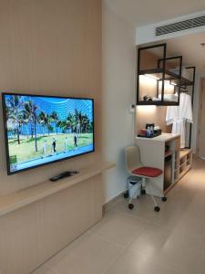 a room with a flat screen tv on a wall at Ahome Cam Ranh in Cam Ranh International Airport