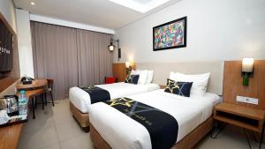 Yellow Star Gejayan Hotelにあるベッド