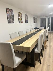 a conference room with a long table and chairs at Studio Coloc in Villenave-dʼOrnon +21 photos