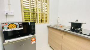 Kuchyň nebo kuchyňský kout v ubytování Petalz Home + 13 fotografií