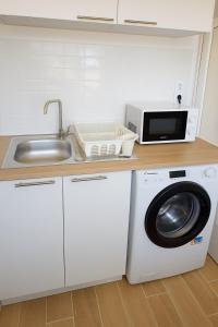 Η κουζίνα ή μικρή κουζίνα στο Appartement de charme Digoin #18