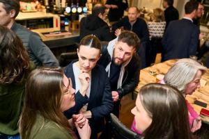 a group of people standing around a table at CoDE Pod – The CoURT - Edinburgh in Edinburgh
