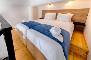 a bedroom with two beds with towels on them at 1901 on Sea in Vis
