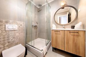 a bathroom with a shower and a toilet and a sink at 1901 on Sea in Vis +16 photos