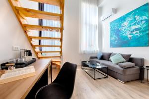 a living room with a couch and a table at 1901 on Sea in Vis