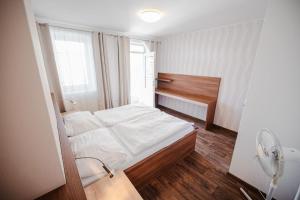 Postel nebo postele na pokoji v ubytování Hotel Palác Elektra