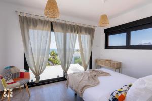 A bed or beds in a room at Villa Ipanema by Abahana Villas Még 22 kép