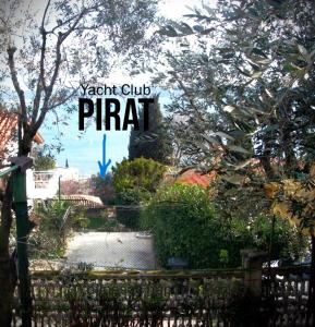 a sign for a park with a fence at Apartments Furlan in Portorož