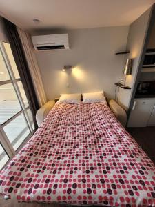 a large bed in a room with a large window at La Perle Blanche in Saint-Raphaël +41 photos