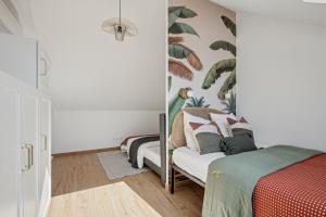 Ένα ή περισσότερα κρεβάτια σε δωμάτιο στο Maison cosy, neuve et lumineuse