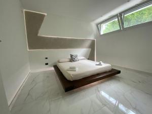 a bedroom with a bed in a room with a window at Villa Serafina in Otranto