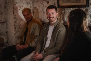 a group of three people sitting on a couch at CoDE Pod – The CoURT - Edinburgh in Edinburgh