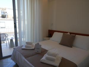 Postel nebo postele na pokoji v ubytování Hotel Regal