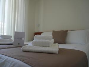 Postel nebo postele na pokoji v ubytování Hotel Regal