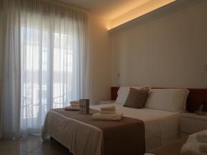 Postel nebo postele na pokoji v ubytování Hotel Regal + 37 fotografií