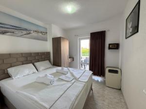 Voodi või voodid majutusasutuse Apartmani Hadžić toas