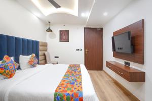Postel nebo postele na pokoji v ubytování FabHotel Golden Eye Inn