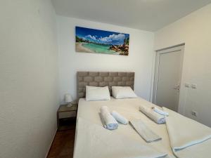 Voodi või voodid majutusasutuse Apartmani Hadžić toas