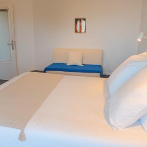 a bedroom with a large bed and a couch at Appartement de charme à Digoin #14 in Digoin