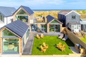 an aerial view of a house with a lawn and chairs at The Ark 4 in Southwold