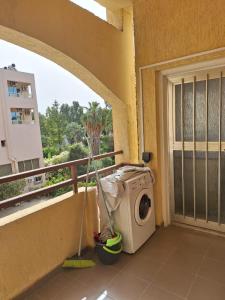 a washing machine on the balcony of a building at TERPSICHORE Holiday Apts in Limassol