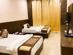 Postel nebo postele na pokoji v ubytování Hotel Sapp-Hire Inn Siwan Bihar + 31 fotografií