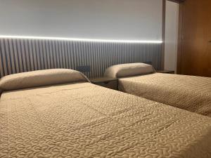 Postel nebo postele na pokoji v ubytování TCH Hotel