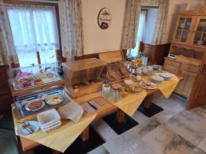 a table with plates of food on top of it at Waldpension Ranner 