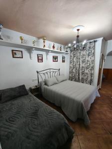Postel nebo postele na pokoji v ubytování Rural El Santiscal + 32 fotografií