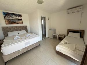 Voodi või voodid majutusasutuse Apartmani Hadžić toas