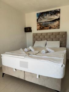 Voodi või voodid majutusasutuse Apartmani Hadžić toas