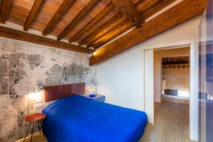 A bed or beds in a room at Le Residenze a Firenze - Residenza Covoni Apartment in the historical center of Florence