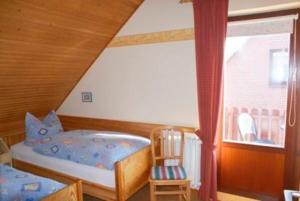 a bedroom with a bunk bed and a window at Große Auszeit in Fehmarn