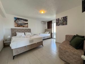 Voodi või voodid majutusasutuse Apartmani Hadžić toas