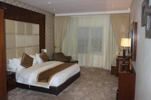 Ένα ή περισσότερα κρεβάτια σε δωμάτιο στο Le Park Shaqra