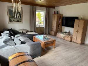 a living room with a couch and a coffee table at Fewo Peter in Marktredwitz