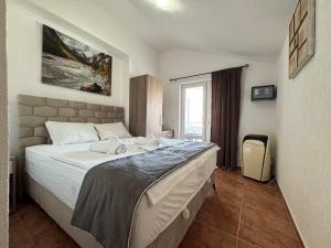 Voodi või voodid majutusasutuse Apartmani Hadžić toas