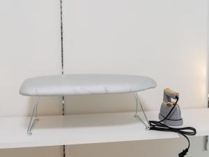 a white bed sitting on top of a shelf at Ikebukuro 10 min-Family-Friendly Stay-Mobile Wi-Fi&Switch-Net in Tokyo