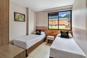 Postel nebo postele na pokoji v ubytování Hotel de la Salle