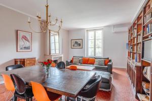 a living room with a table and a couch at Château de Bayssan in Béziers