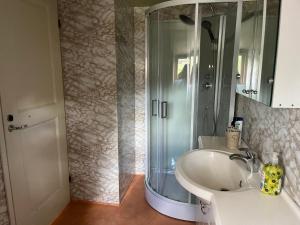 a bathroom with a shower and a sink at Forest nine Villa in Kuusalu +26 photos